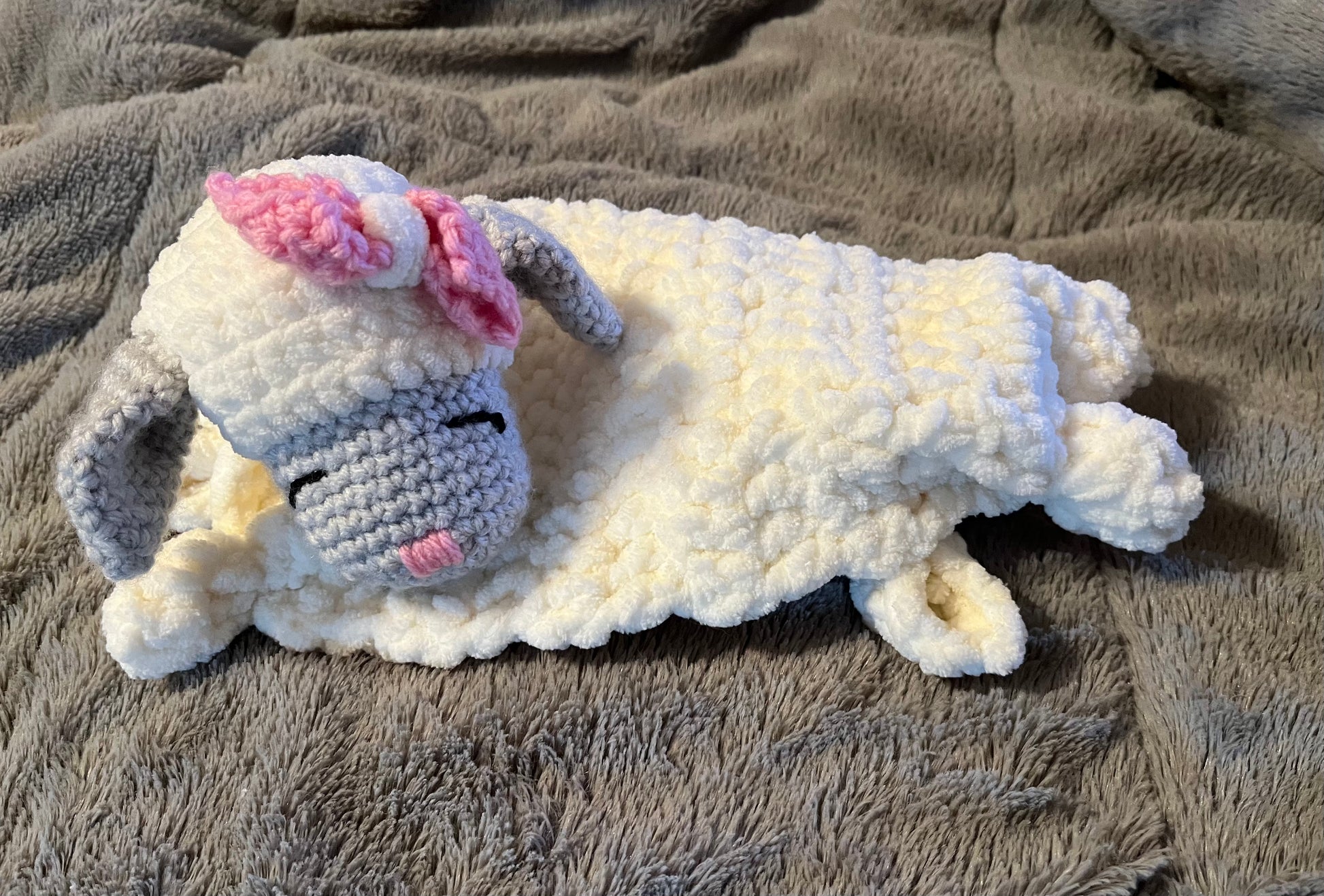 Soft and snuggly crocheted lamb lovey